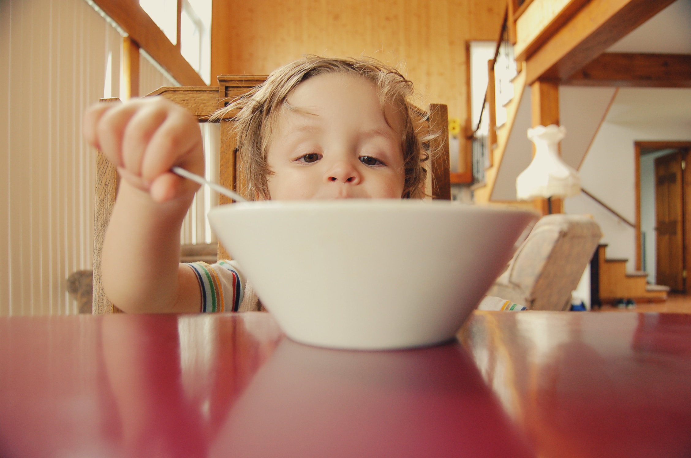 child eating from bowl