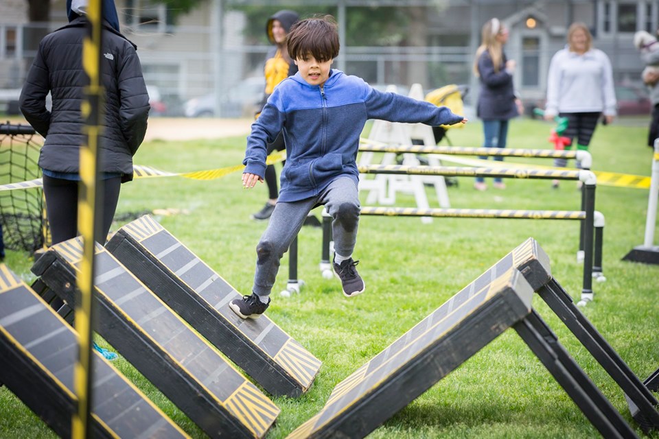 Young boy on challenge obstacle course