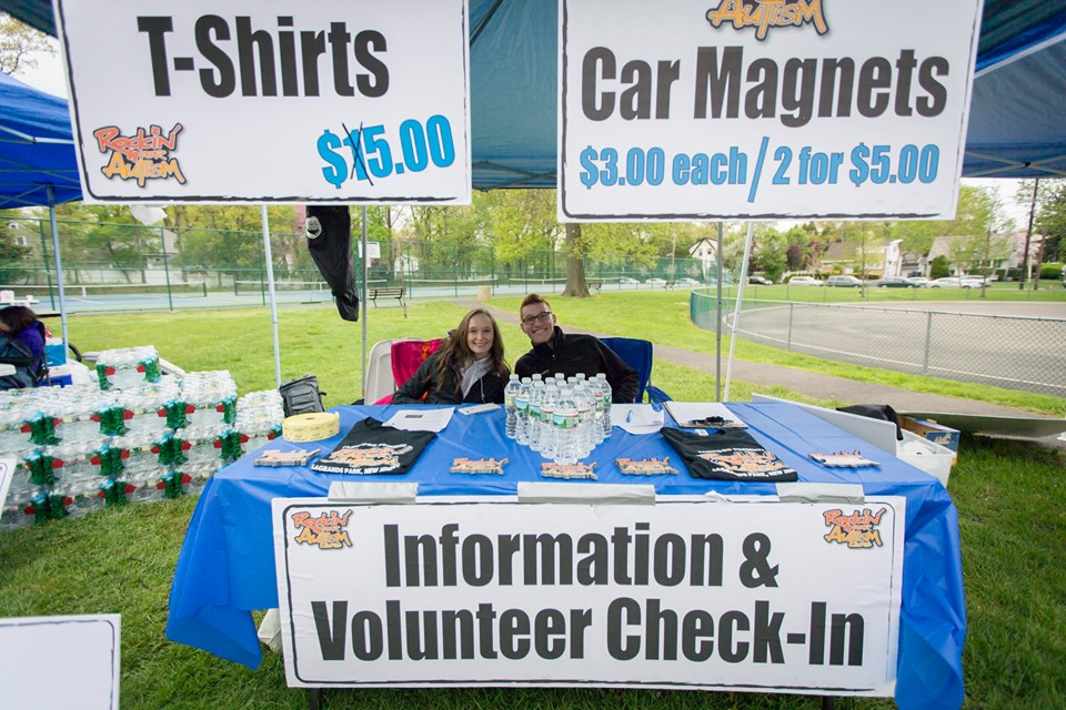 Volunteers are prepared to offer information and check-in assistance to festival-goers.
