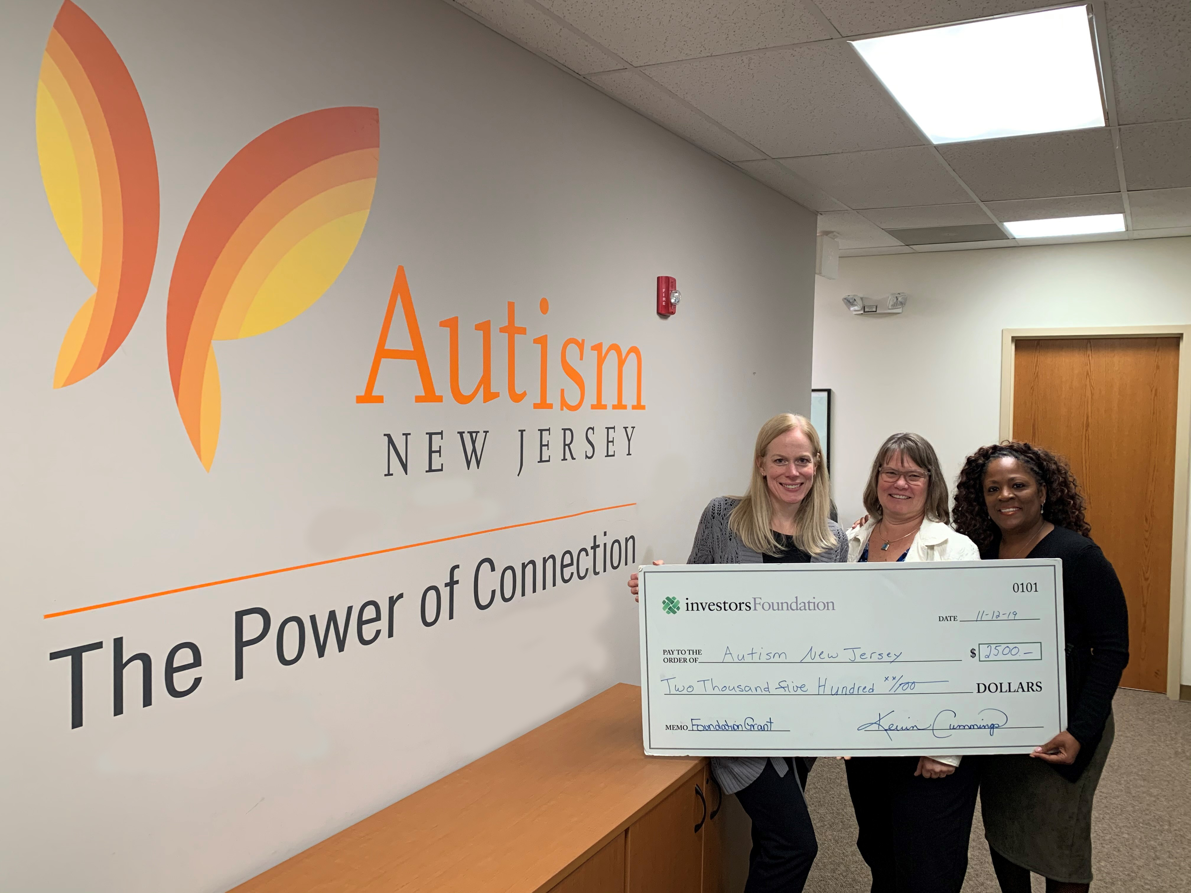 Autism New Jersey Executive Director Suzanne Buchanan with Investors Bank representatives